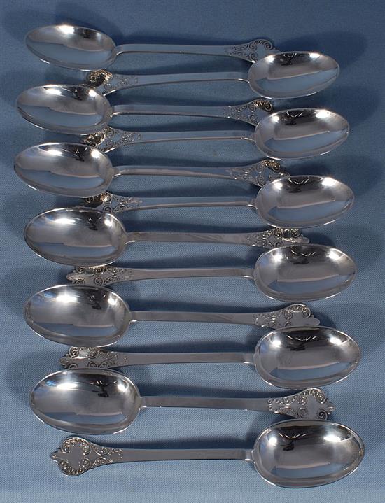 A George V silver canteen of 17th century style lace back trefid pattern cutlery, 110oz/ 3430 grams.